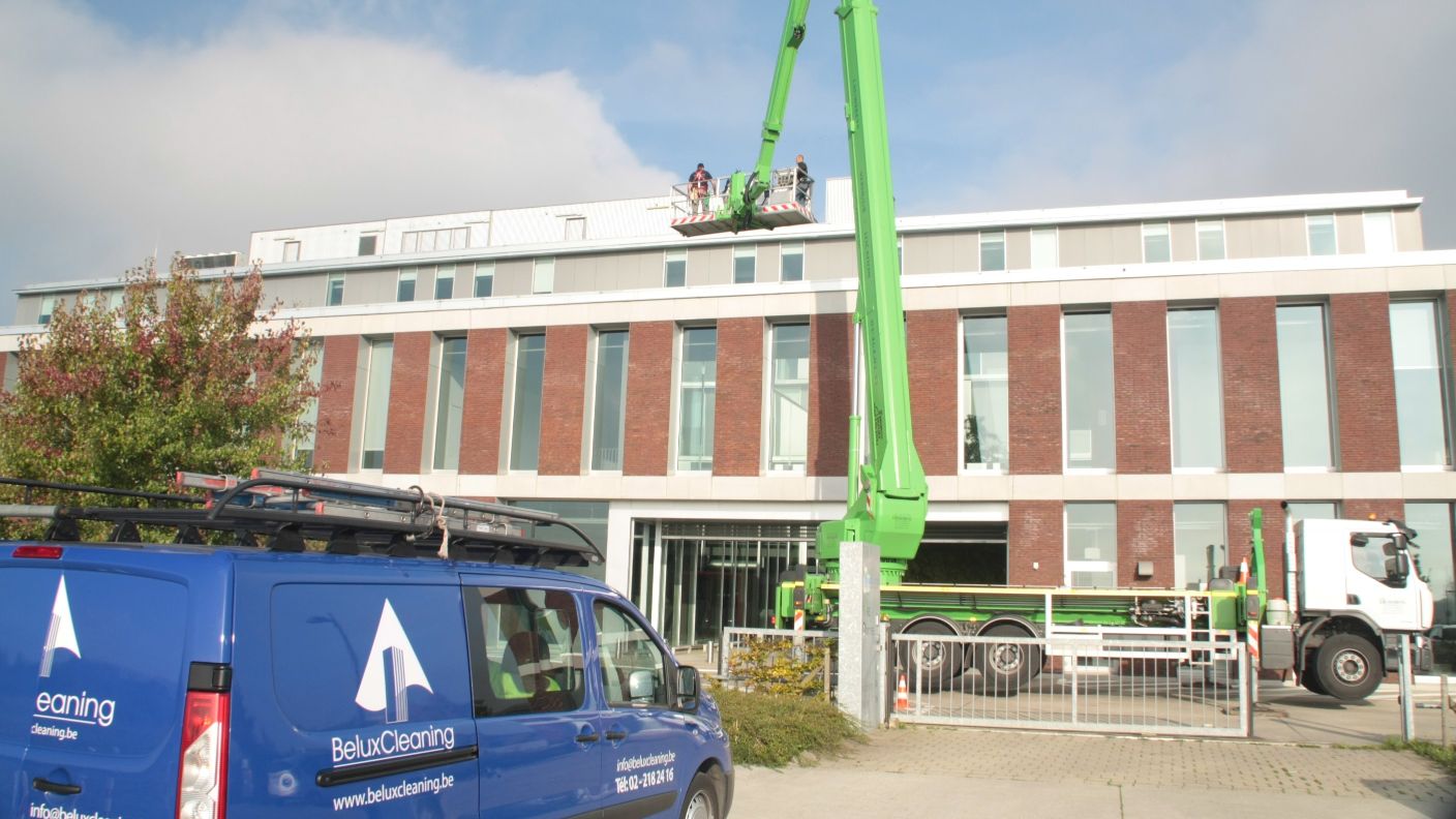 window cleaning in a private building with a cherry picker