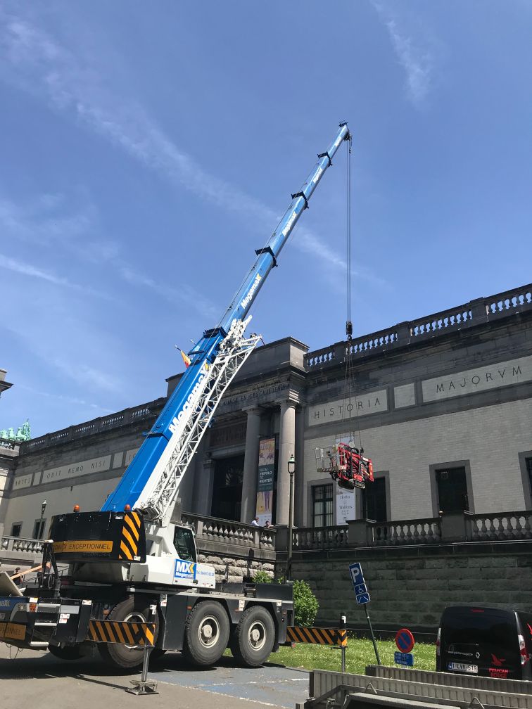 window cleaning in a museum with a cherry picker