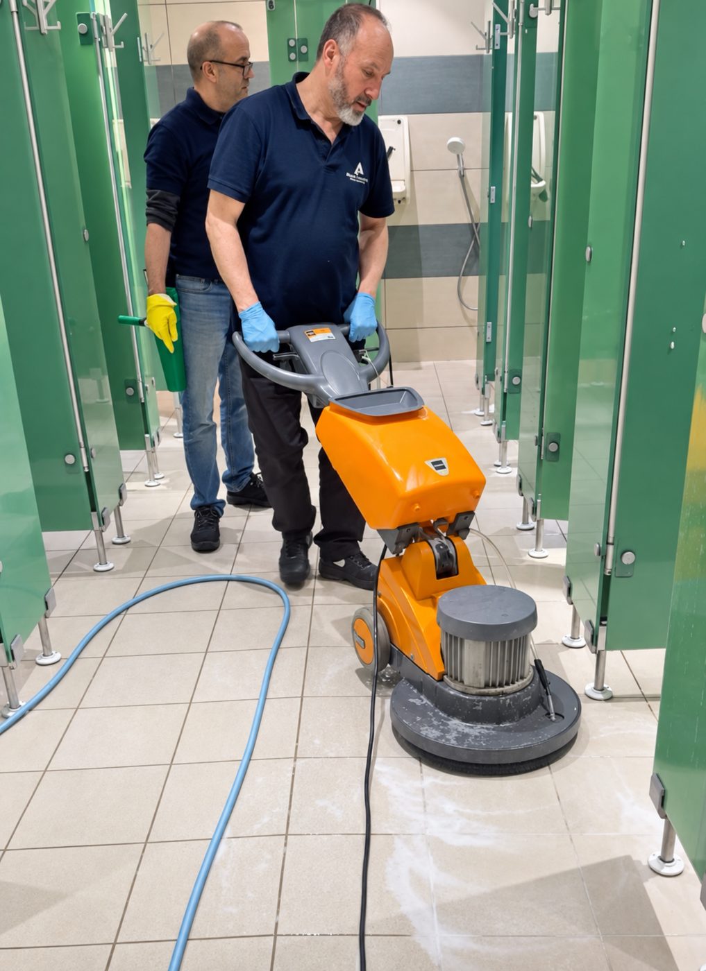 Cleaning the showers and changing rooms of a gym